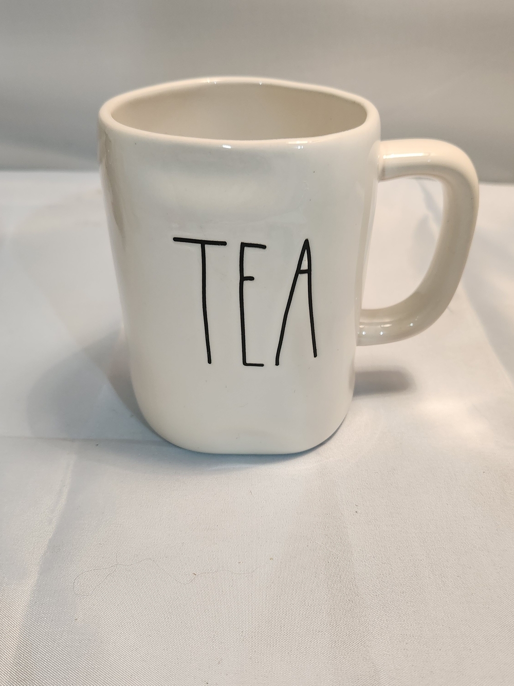 Rae Dunn Cream Ceramic Mug with 'TEA' in Black